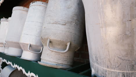 several aluminium cans for milk on a small farms 4k video