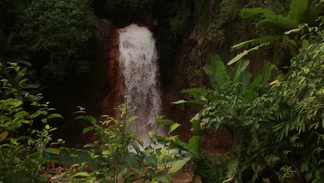 Calm-and-soothing-ambient-motion-of-the-cascading-waters-in-Pulangbato-Falls-framed-by-lush-foliage,-a-popular-travel-destination-in-Valencia,-Negros-Oriental,-Philippines