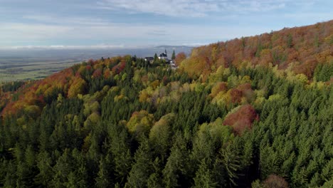 aerial establishing shot of the sanctuary of mary of the snow in sudety mountains, poland