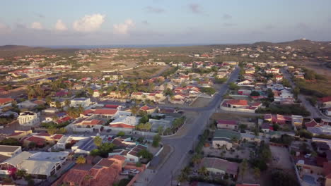 streets and residential neighbourhood of noord, aruba with the blue sea in the background