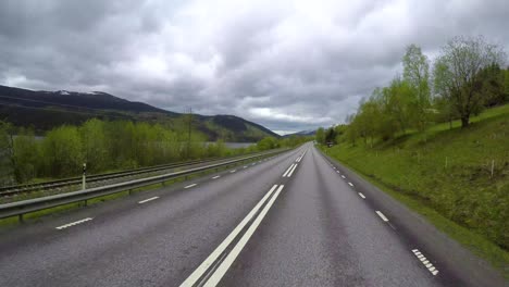 driving a car on a road in norway time lapse