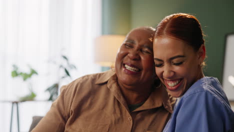 caregiver and senior woman sharing a laugh