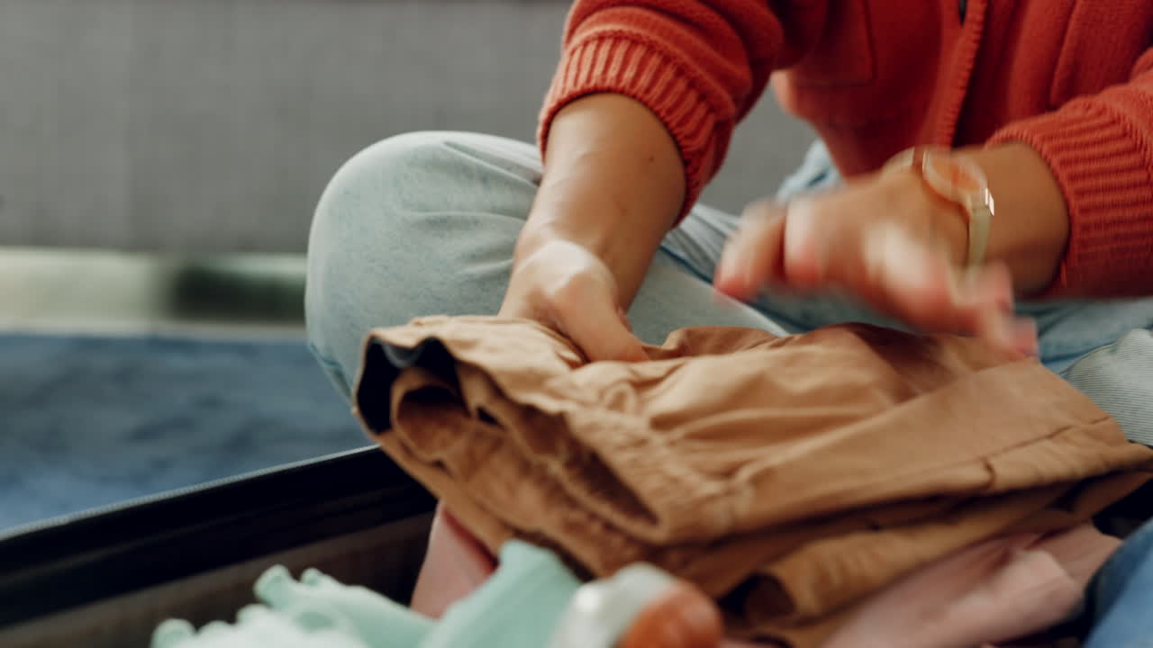 Hands, luggage and travel with a woman packing
