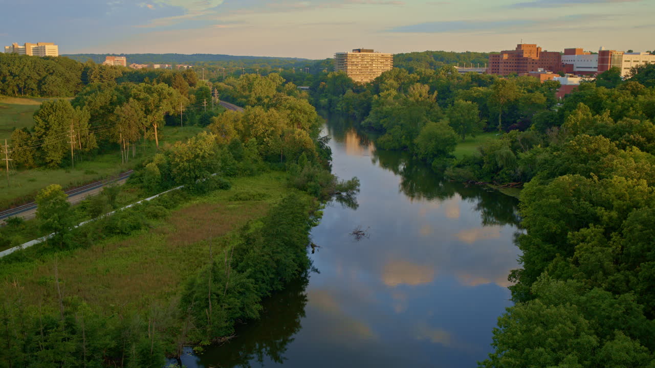 Softly gliding drone above the Huron River in Ann Arbor, Michigan, on a summer day.