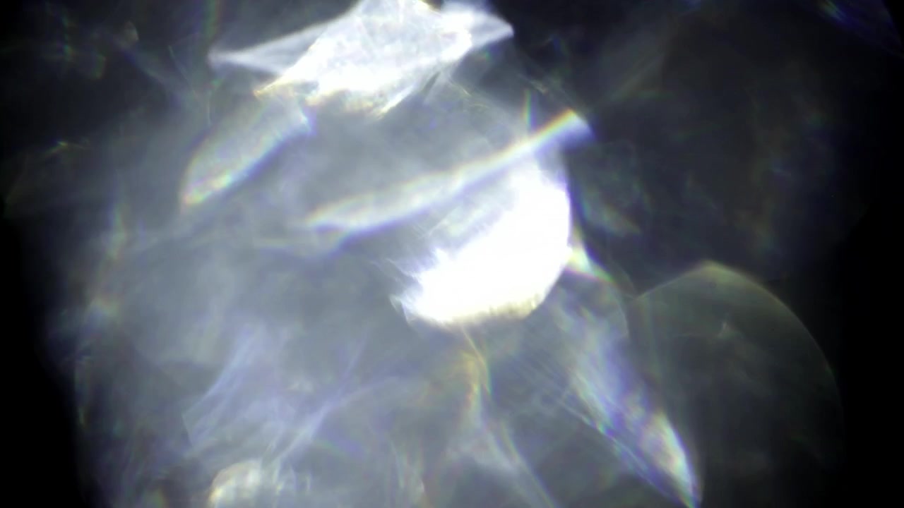 Abstract glass light leaks reflections on black background