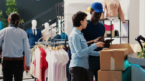 employees checking cardboard boxes