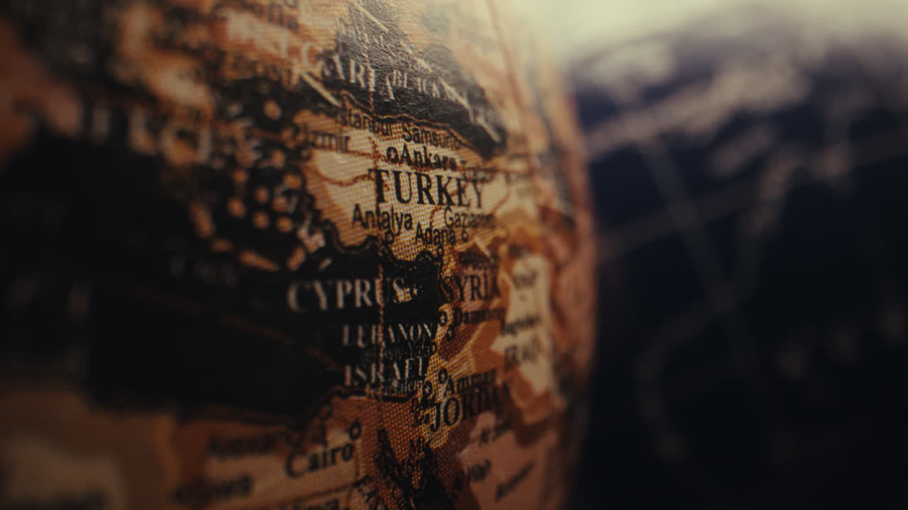Close-up of a vintage world globe map, highlighting the Middle East