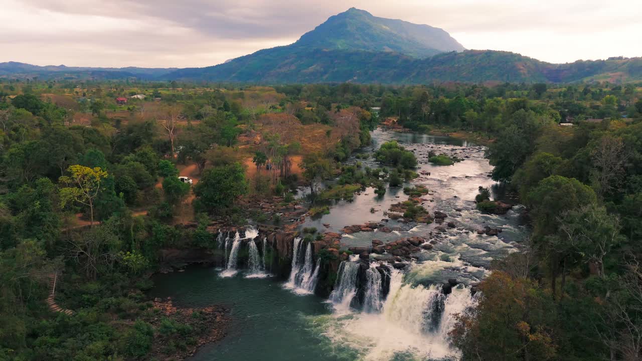 Aerial drone above Bolaven Plateau waterfall near Pakse Laos travel destination motorcycle loop adventure
