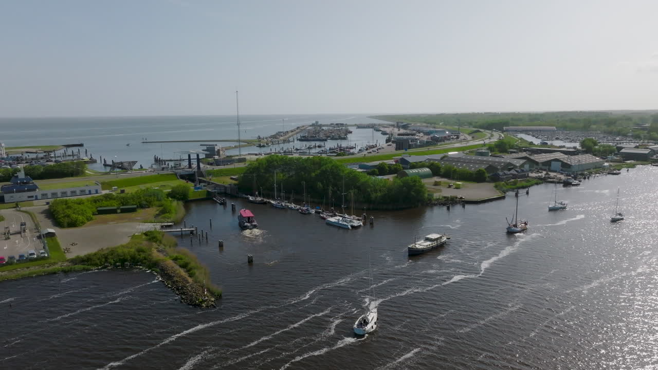 An aerial view of the Dutch port of Lauwersoog reveals a complex network of vessels traversing the area. Netherlands