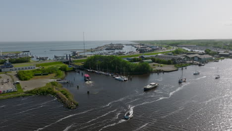 an aerial view of the dutch port of lauwersoog reveals a complex network of vessels traversing the area. netherlands