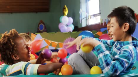 kids playing together in ball pool 4k