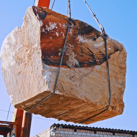 marble blocks and crane on quarry