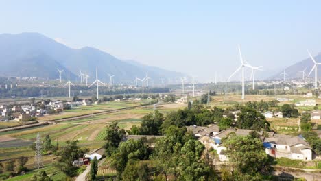 drone shots of a large chinese windfarm located in the valley of sichuan