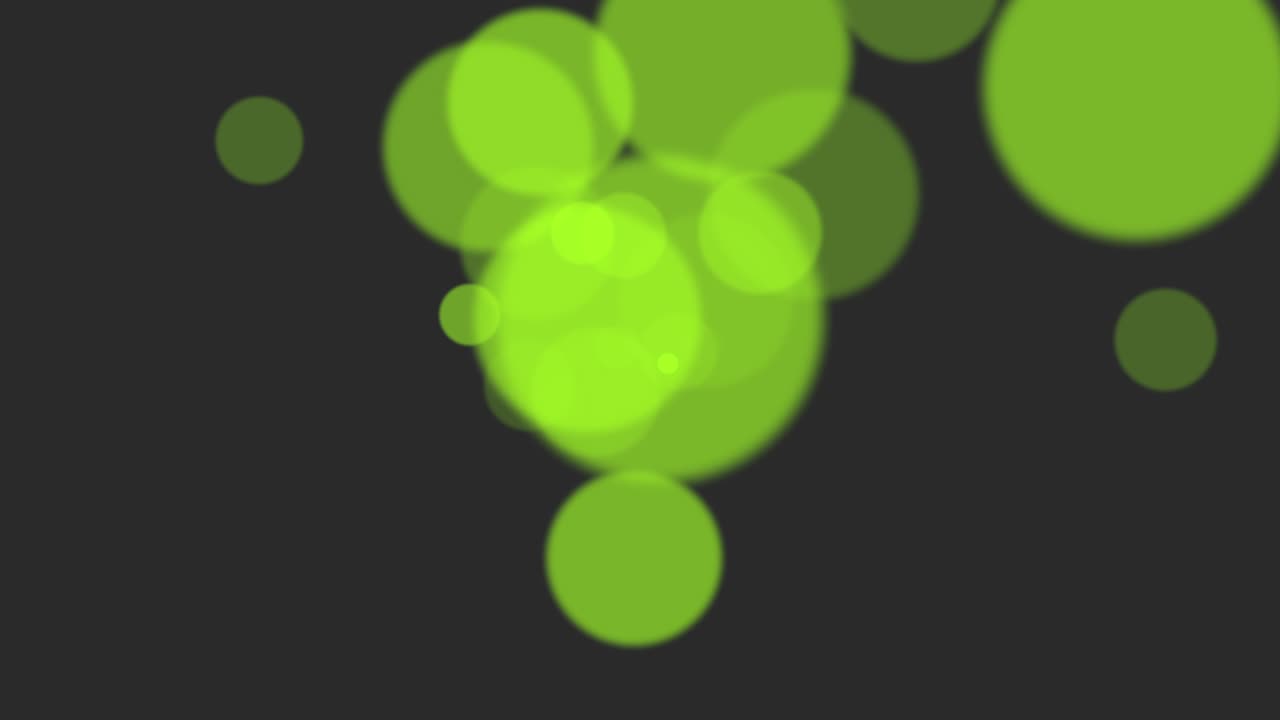 Green particles and round bokeh on shiny background