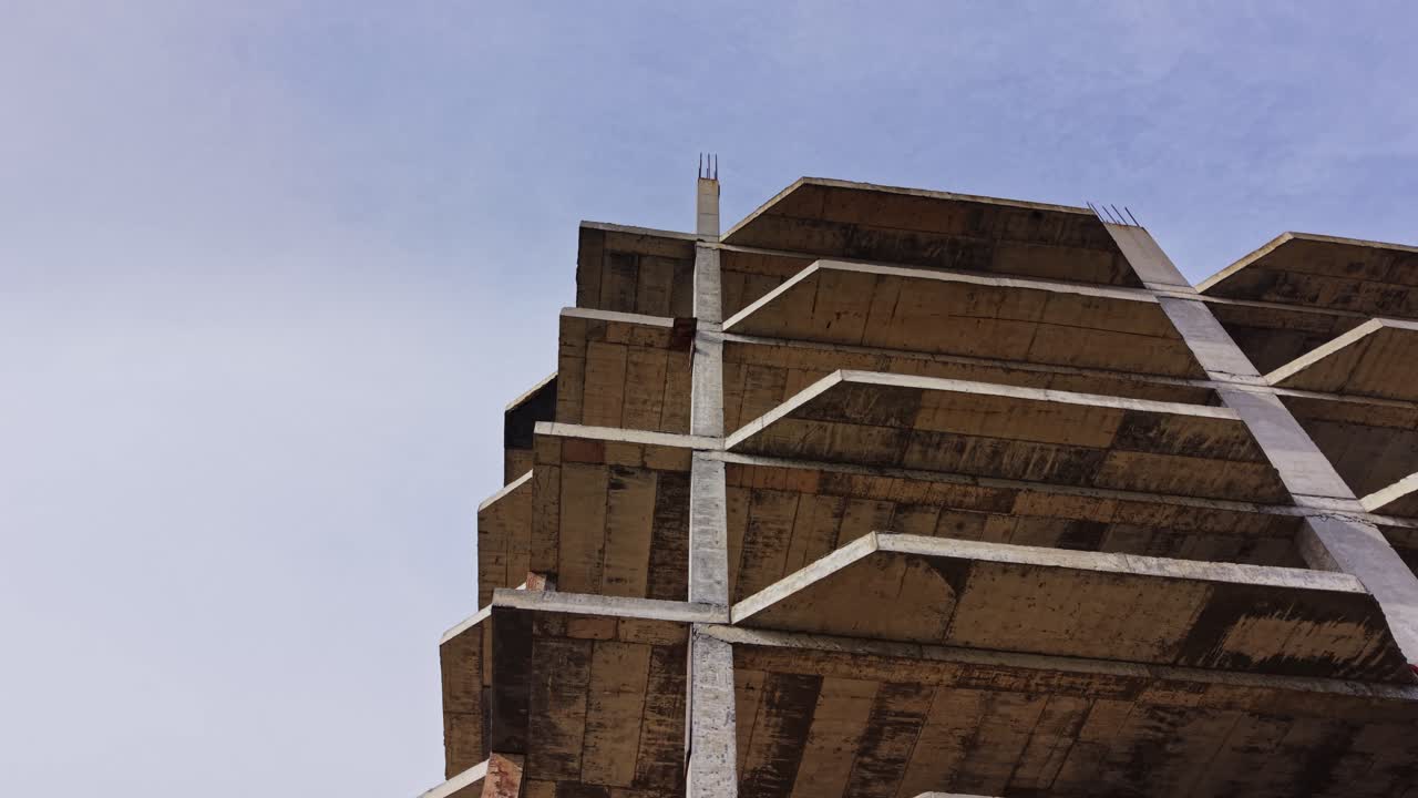 View of a derelict building from above showing concrete structure details
