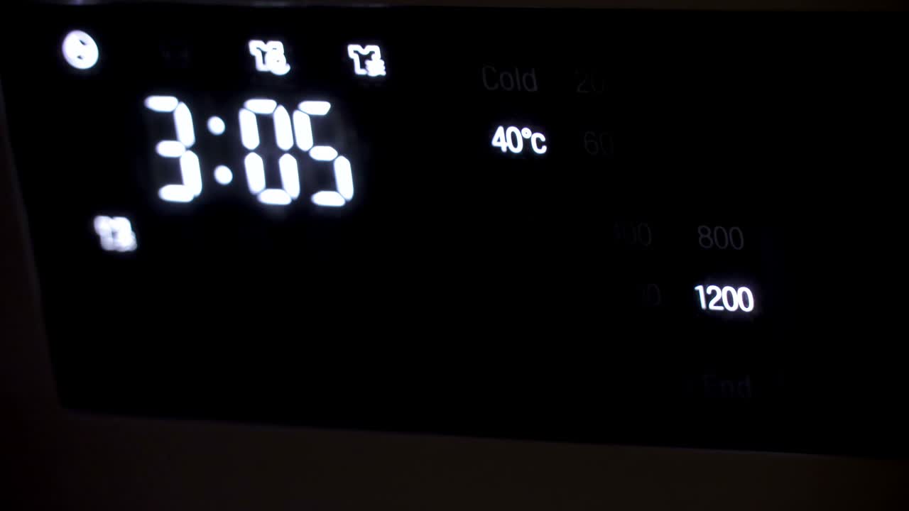 The digital time on the wall clock in the building