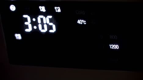 the digital time on the wall clock in the building