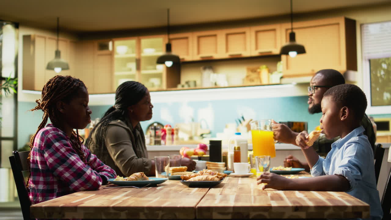 Family having breakfast in the kitchen