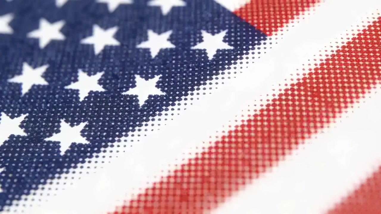Shimmering US flag textile shifting under camera push-in in studio revealing halftone weave