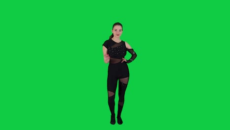 Female-dance-instructor-teaching-a-modern-dance-class-in-front-of-the-green-screen