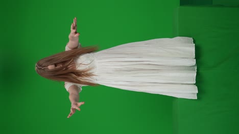 fullsize green screen chroma key video of a posessed female woman figure ghost poltergeist - full-size green screen, chroma key video of a posessed female, woman figure, ghost, poltergeist, zombie standing with her arms down, staggering, hunched. horror clip, advertisement, dead. chroma key