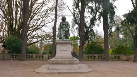 statue of eugène chevreul in jardin des plantes, angers, france - panning shot