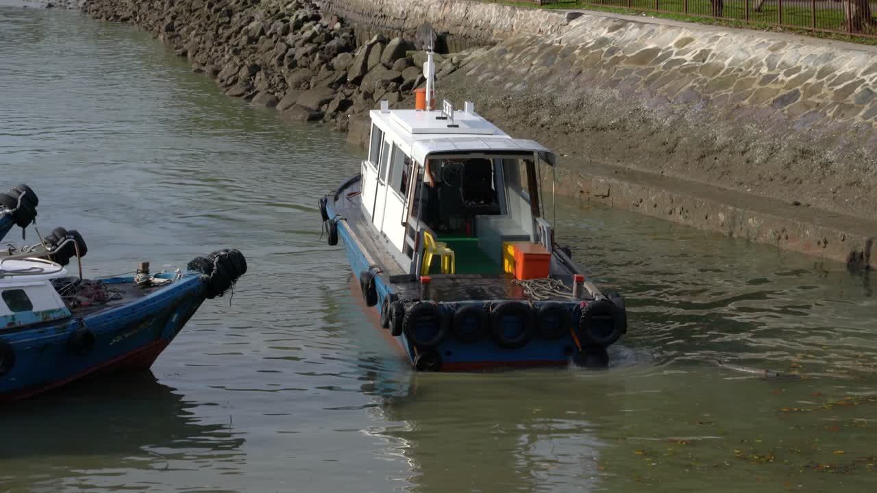 Motorboat approaching pier at Changi Beach, Singapore