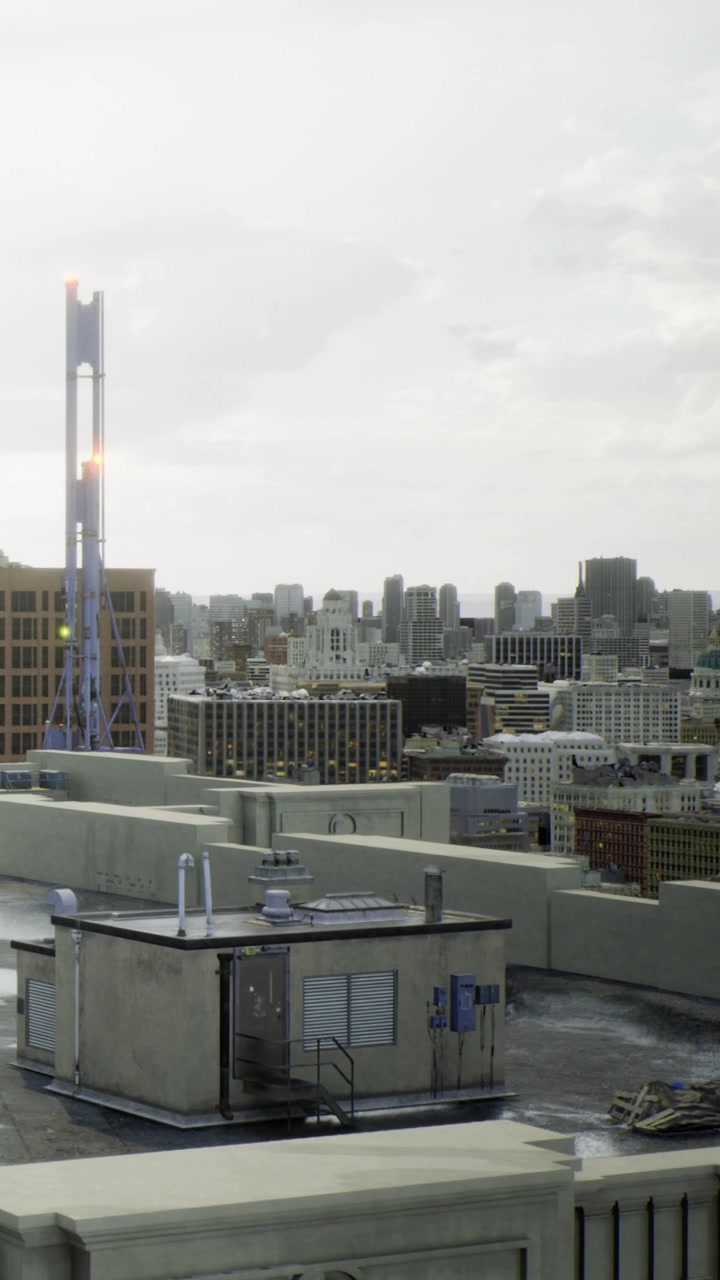 Urban skyline at dusk with water tower and distant buildings glowing softly