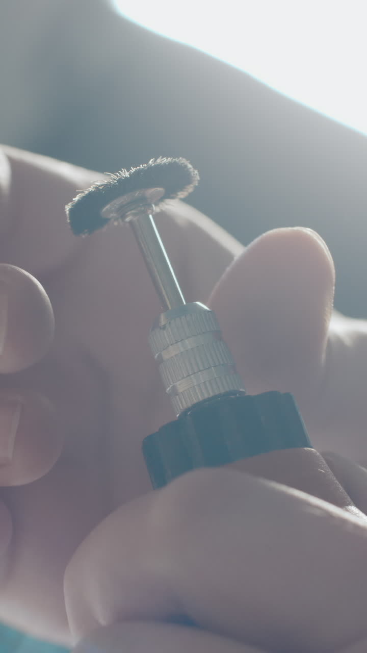 Close up of a person working with small hand tools