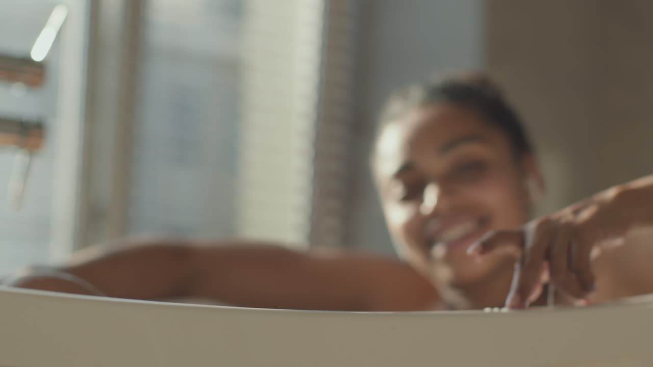 Woman relaxing in a bath