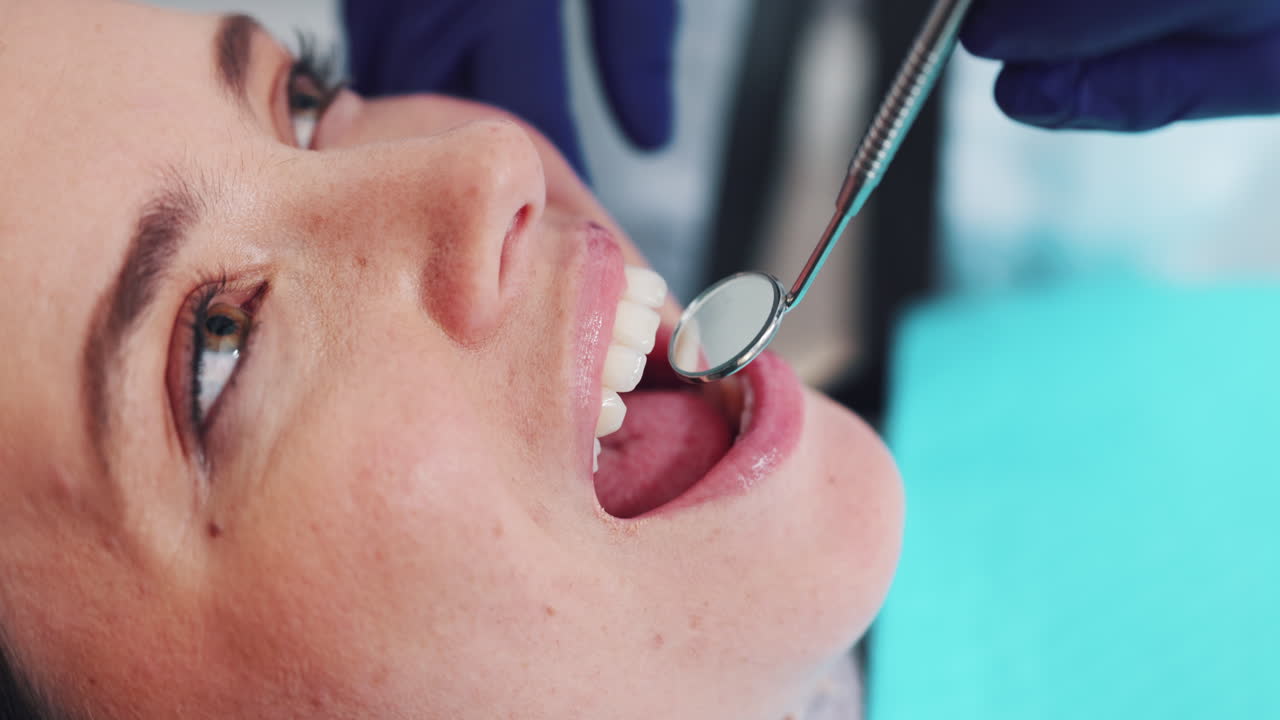 A woman receiving a dental exam
