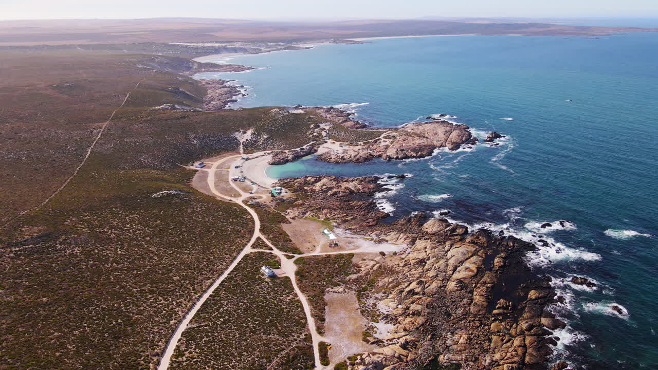 High drone view over Cape West Coast shoreline with popular Tietiesbaai campsite