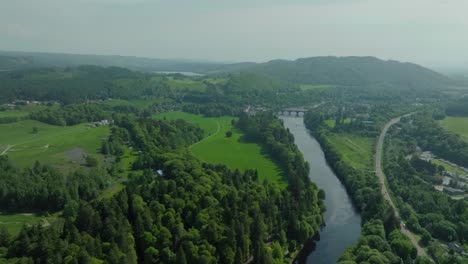 river tay winding through dunkeld in scotland, aerial view over countryside