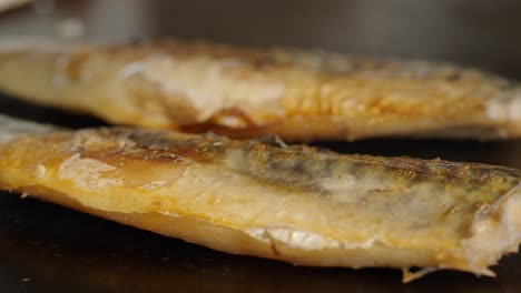 grilled fish on a hot plate