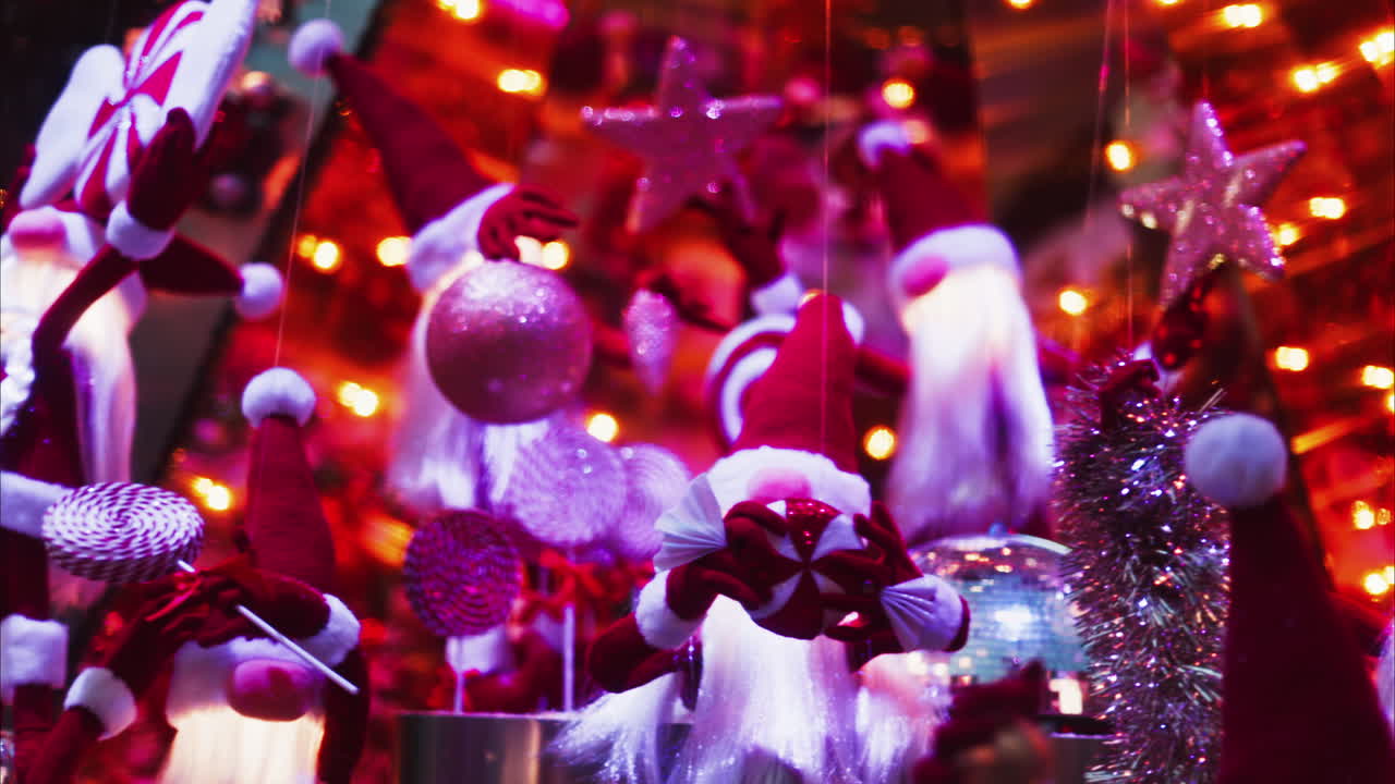 Multiple Santa Claus Christmas decorations moving in bubbles in the courtyard of the Monte Carlo Casino