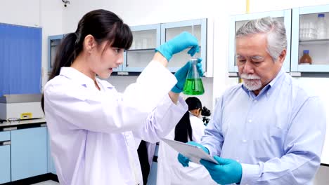 the professor teaching student in research lab. people with science concept.