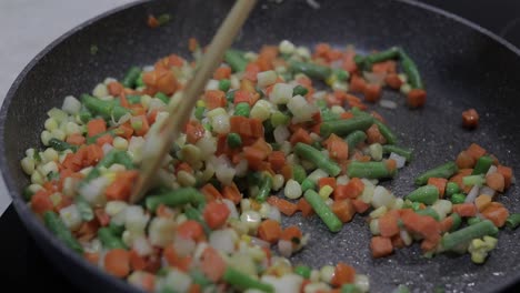 pan fry meal of delicious asparagus, pepper, corn and carrot. vegetarian meal