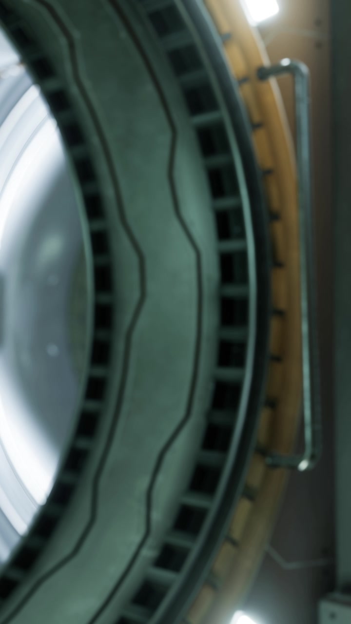 Close view of a washing machine drum during a cycle at home in the afternoon