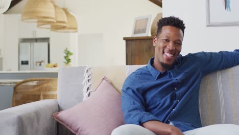 portrait of african american man smiling in living room