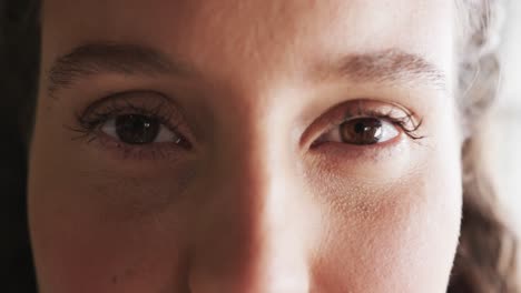 Portrait-of-happy-eyes-of-caucasian-casual-businesswoman-in-office,-slow-motion