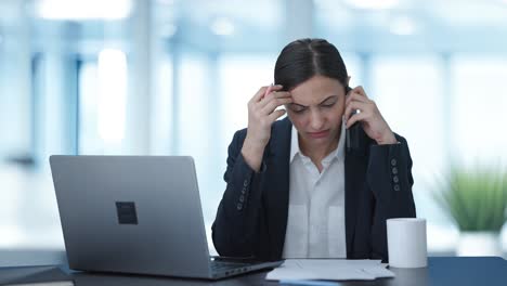 angry indian female manager shouting on mobile phone