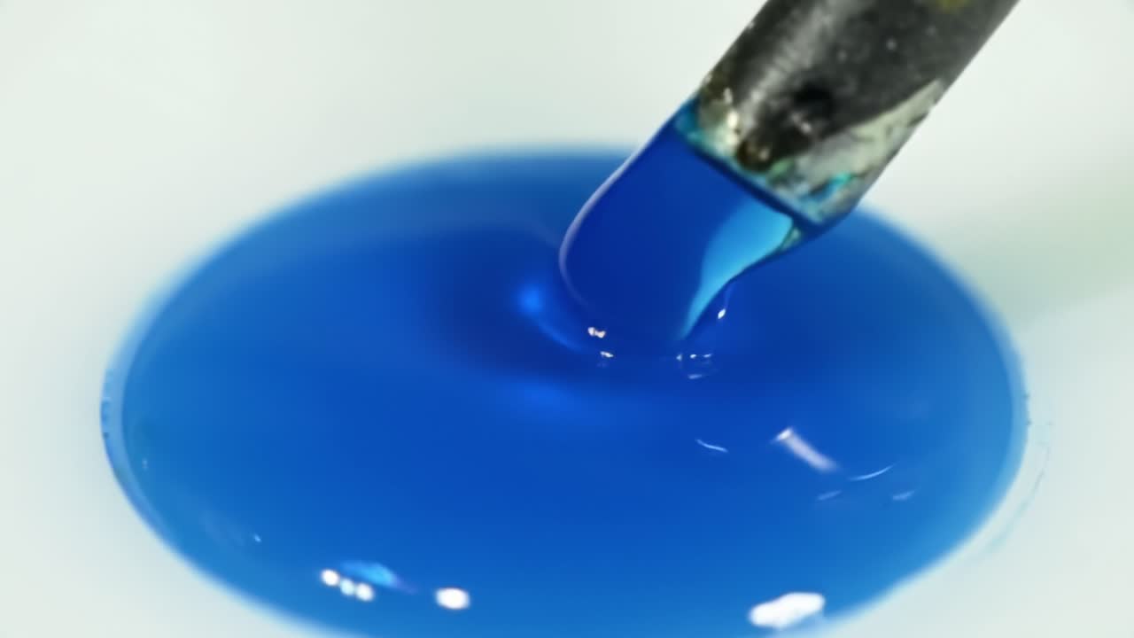 Exploring the Vibrant Reaction of Blue Dye in Water During a Science Experiment