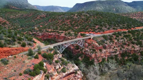 drone footage of a beautiful bridge crossing the red rocks in sedona, arizona