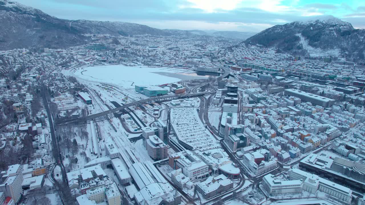 Bergen cityscape establisher aerial shot, Norway city, tilt up reveal horizon