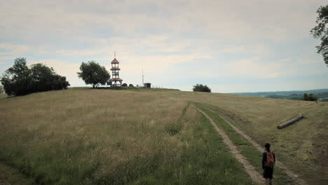 wide panoramic shot of a hiker man with