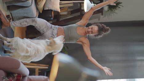 woman doing yoga with her dog