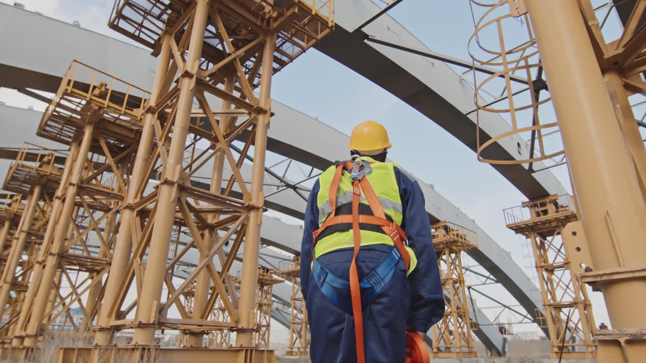 Construction Worker with Safety Belt at Work