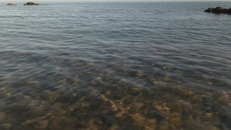 Clear-transparent-holiday-ocean-seascape-tilt-up-to-beautiful-Spanish-horizon-dolly-left