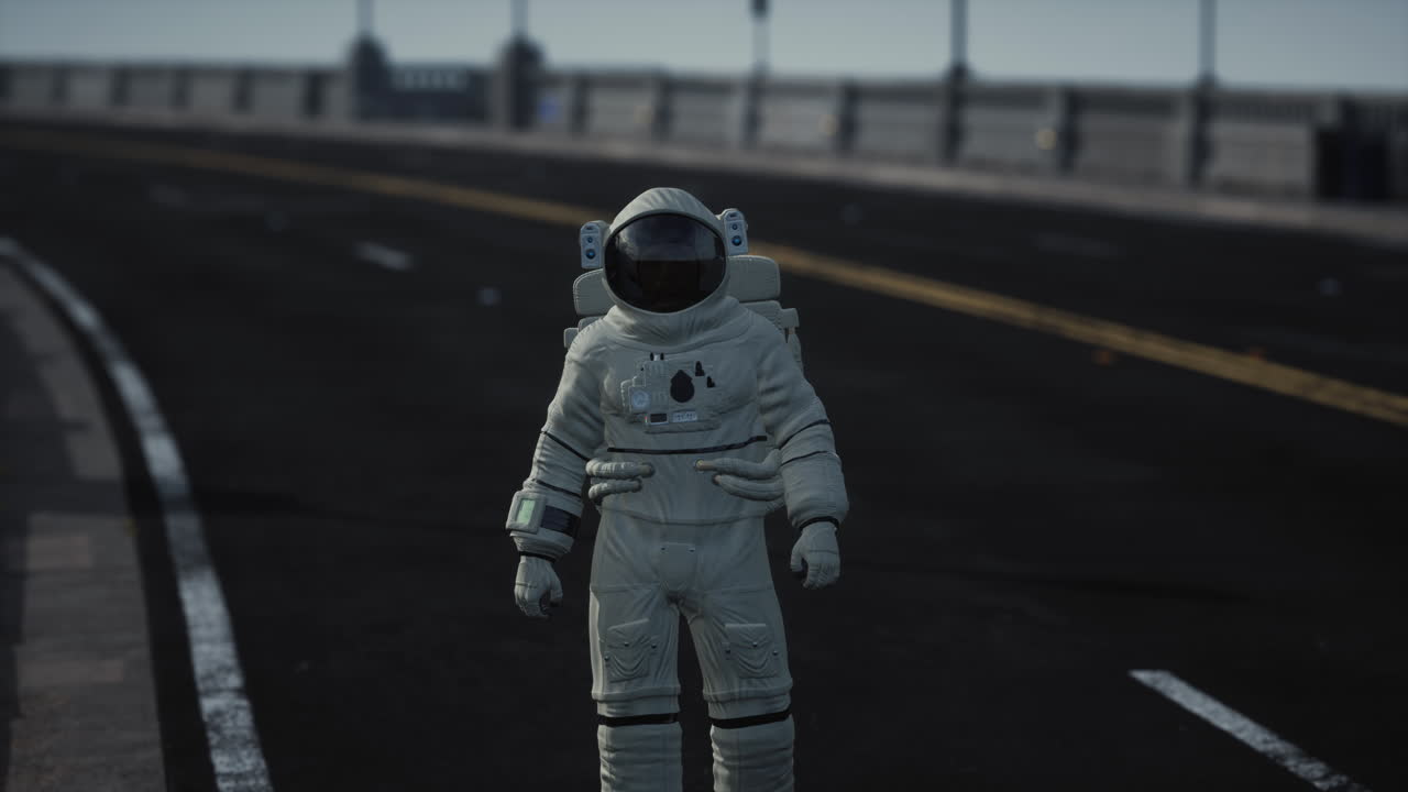 astronaut walks in the middle of a road