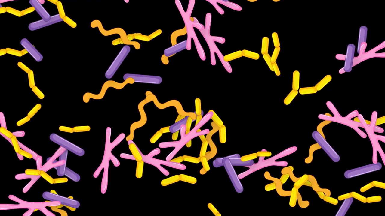 Vibrant 3D shapes fall continuously through a dark void in a seamless loop animation.